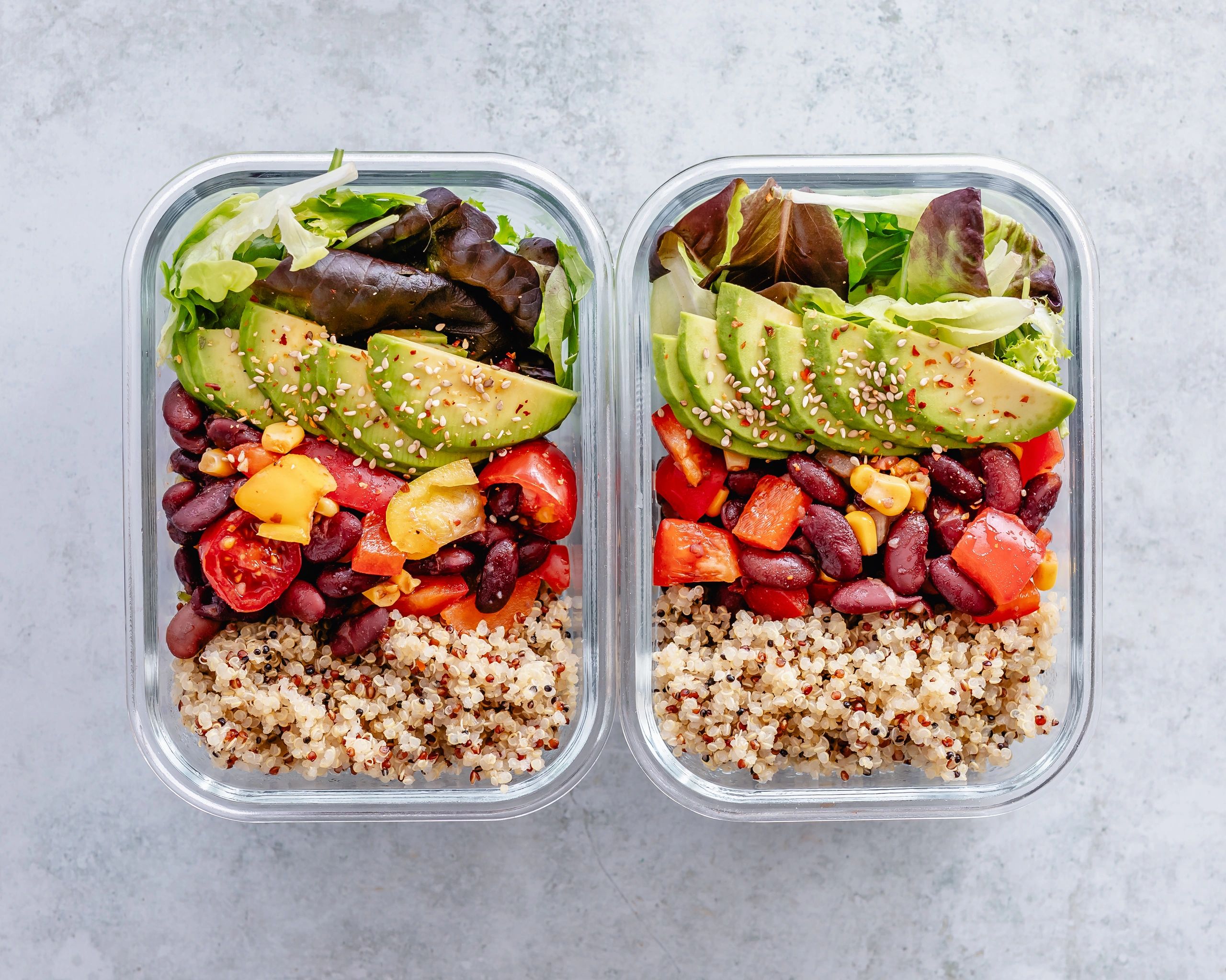 Assorted healthy meal prep bowls with colorful vegetables